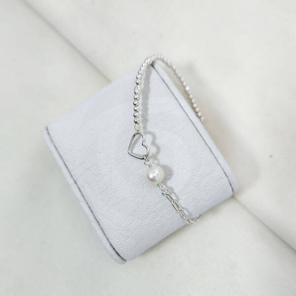 Pulsera corazon con perla en doble tejido